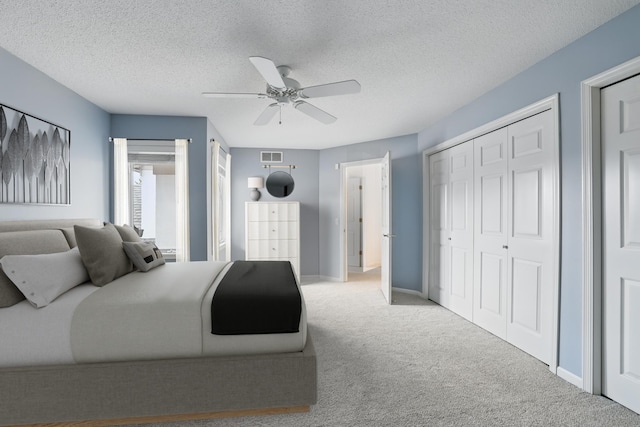 5541 70th St, Edina, MN 55439 - carpeted bedroom with a closet, a ceiling fan, baseboards, and a textured ceiling