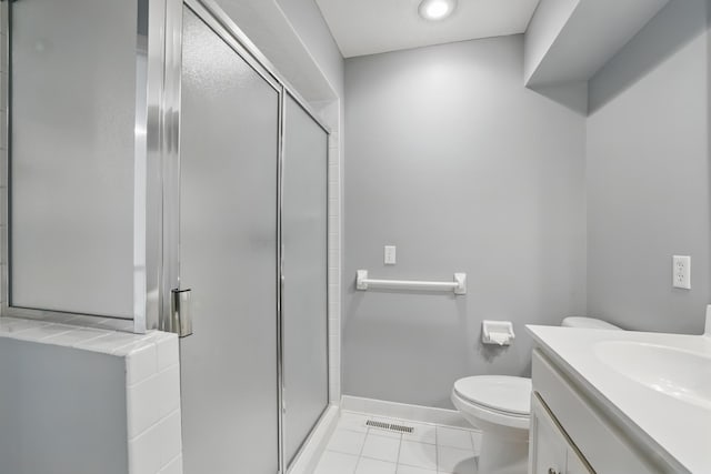 5541 70th St, Edina, MN 55439 - full bathroom with a stall shower, toilet, vanity, and tile patterned flooring