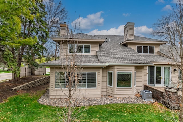5541 70th St, Edina, MN 55439 - back of property featuring a chimney and cooling unit