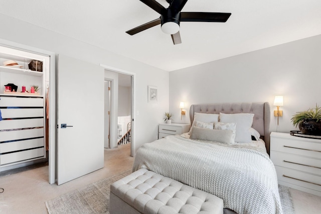 bedroom featuring a ceiling fan and carpet