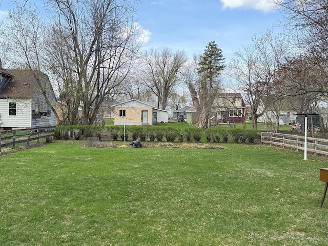 view of yard featuring a residential view and fence