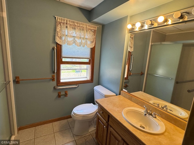 full bathroom with a shower with shower door, tile patterned floors, toilet, vanity, and baseboards