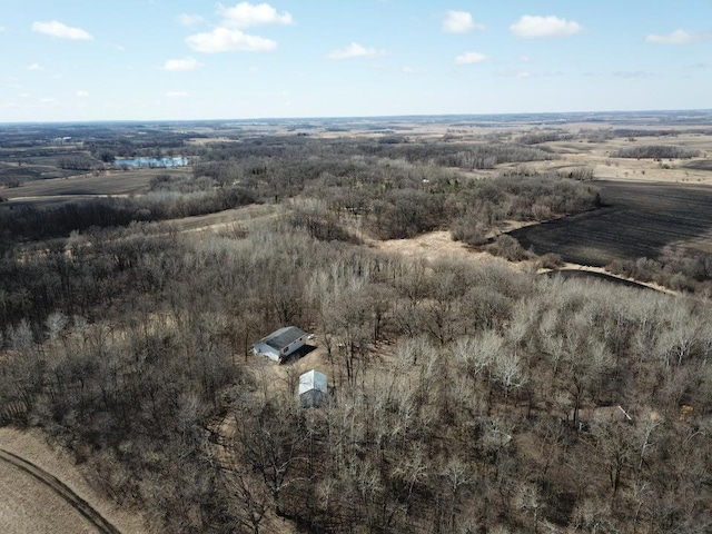 birds eye view of property with a rural view