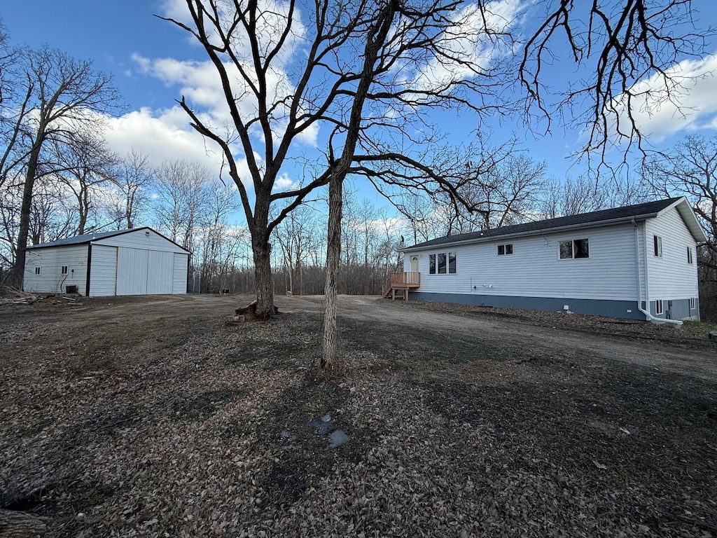 22939 US Highway 59, Detroit Lakes, MN 56501 - view of yard featuring a detached garage and an outbuilding