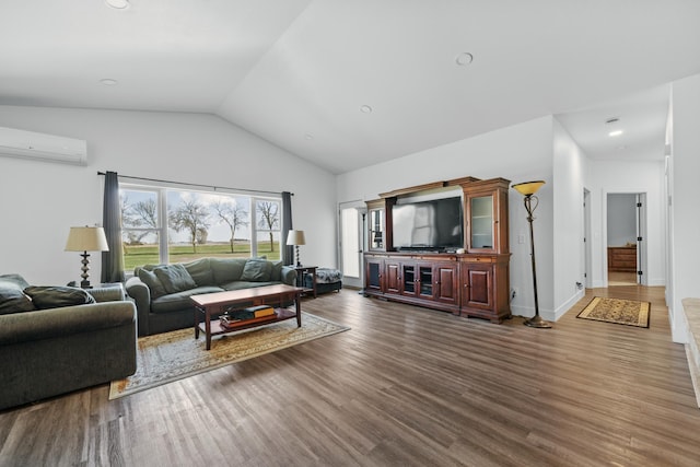 living area with high vaulted ceiling, baseboards, a wall mounted AC, and wood finished floors