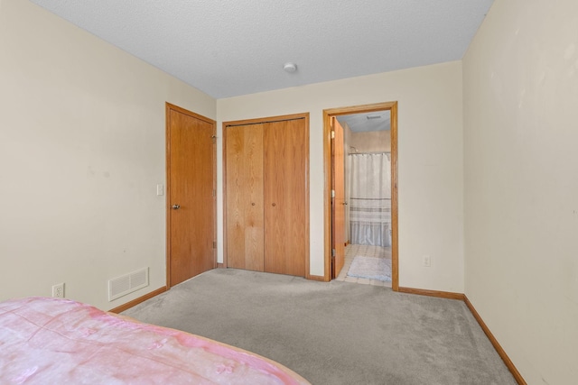 26294 3rd St W, Zimmerman, MN 55398 - bedroom with carpet flooring, visible vents, a closet, baseboards, and ensuite bath