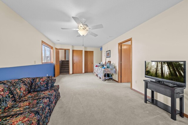 26294 3rd St W, Zimmerman, MN 55398 - living room featuring stairway, carpet, and a ceiling fan