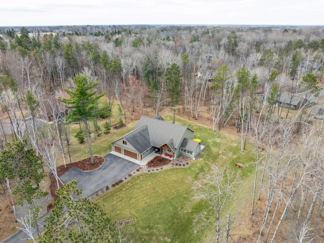 birds eye view of property with a forest view