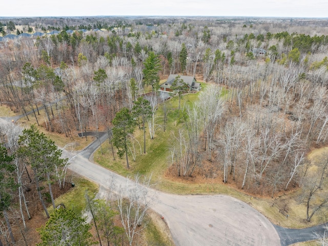 aerial view featuring a wooded view