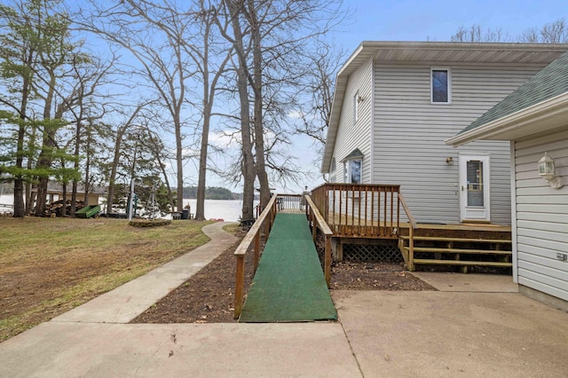 34470 Spruce Ln, Pequot Lakes, MN 56472 - view of grassy yard with a deck with water view and a patio area