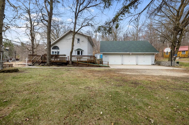 34470 Spruce Ln, Pequot Lakes, MN 56472 - view of front of home with driveway, an outdoor structure, a wooden deck, and a front yard