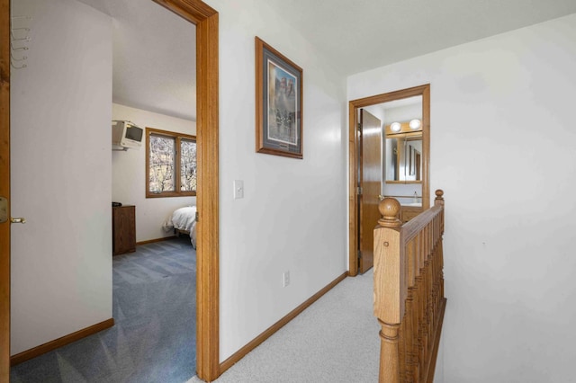 34470 Spruce Ln, Pequot Lakes, MN 56472 - hall featuring carpet flooring, an upstairs landing, baseboards, and a wall mounted AC