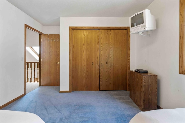 34470 Spruce Ln, Pequot Lakes, MN 56472 - carpeted bedroom with an AC wall unit and baseboards