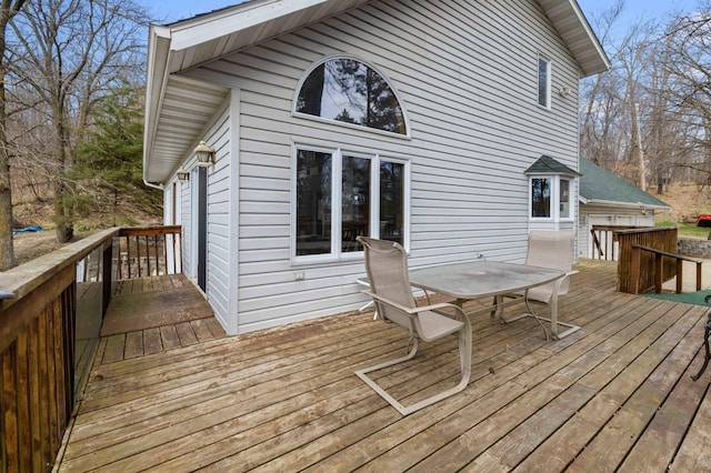 34470 Spruce Ln, Pequot Lakes, MN 56472 - wooden terrace with outdoor dining space