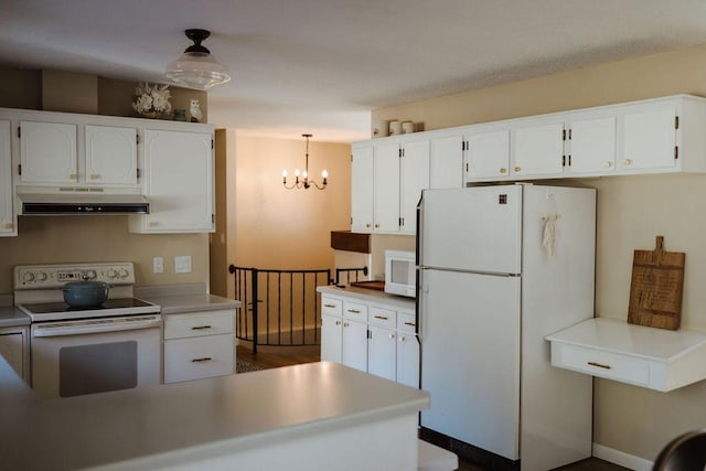 kitchen featuring white appliances, white cabinetry, a notable chandelier, and under cabinet range hood