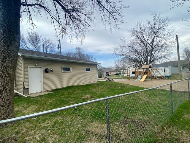 exterior space featuring a lawn, fence private yard, and a playground