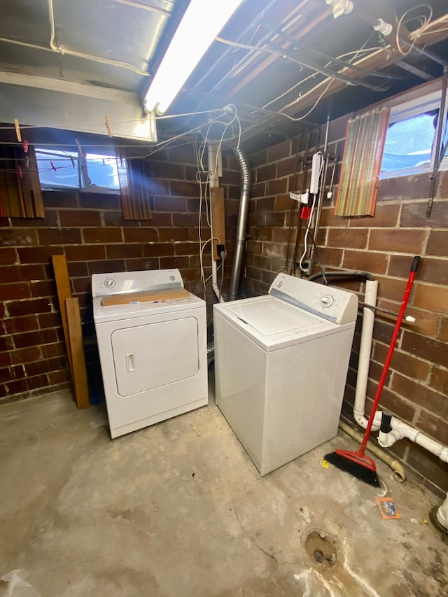 clothes washing area with washer and dryer and laundry area