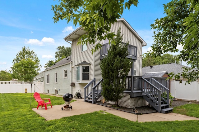 6049 Wentworth Ave, Minneapolis, MN 55419 - back of property with a balcony, a gate, a fenced backyard, a patio, and a deck