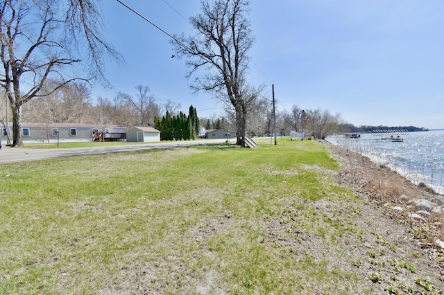 view of yard with a water view
