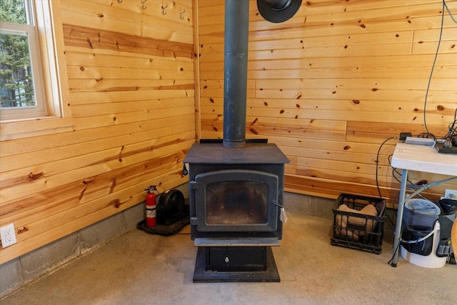 8494 Peary Junction Rd, Kelsey, MN 55724 - detailed view of a wood stove, a fire extinguisher, and wooden walls