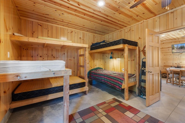 8494 Peary Junction Rd, Kelsey, MN 55724 - bedroom featuring wood walls, concrete flooring, and wood ceiling
