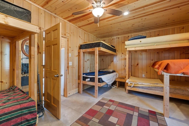 8494 Peary Junction Rd, Kelsey, MN 55724 - bedroom featuring wood walls, wooden ceiling, and concrete floors
