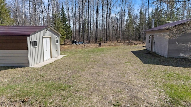 8494 Peary Junction Rd, Kelsey, MN 55724 - view of green lawn with an outbuilding and a shed