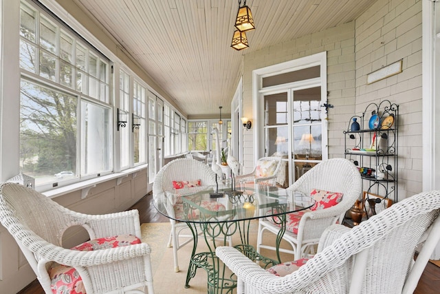 sunroom / solarium with wood finished floors and wooden ceiling