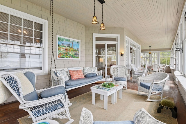 sunroom featuring outdoor lounge area