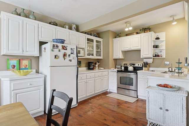 kitchen featuring a sink, white cabinets, dark wood-style floors, glass insert cabinets, and white appliances
