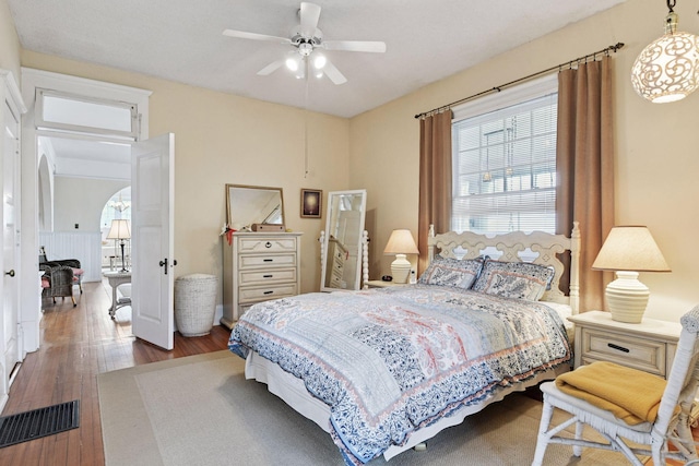 bedroom featuring wood-type flooring and visible vents