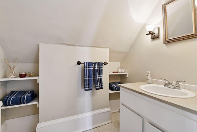 bathroom featuring vanity and vaulted ceiling