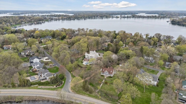 birds eye view of property with a water view and a residential view