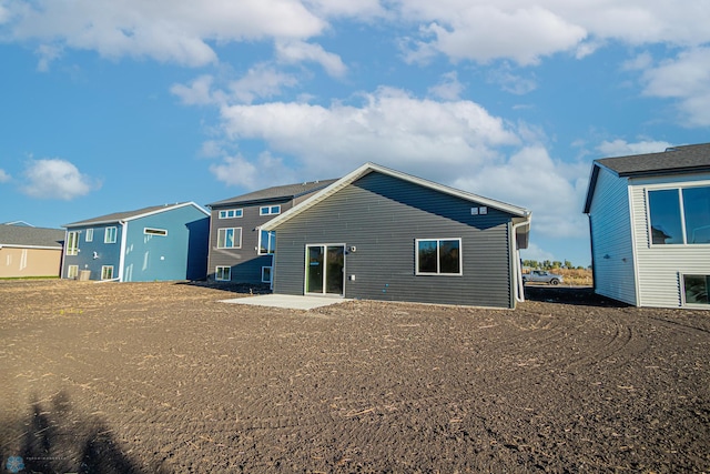 back of house featuring a residential view
