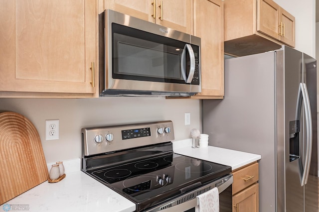 5862 Ellis Dr S, Horace, ND 58047 - kitchen featuring stainless steel appliances, light brown cabinetry, and light countertops