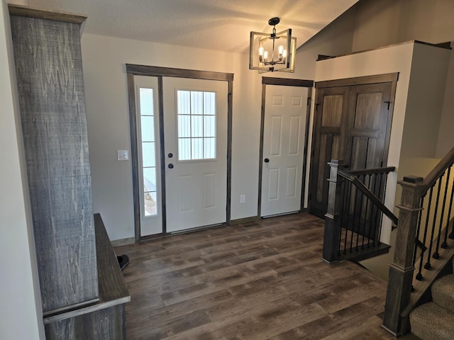 9972 14th Cir NE, Saint Michael, MN 55376 - foyer entrance featuring dark wood-type flooring, a chandelier, vaulted ceiling, and stairs