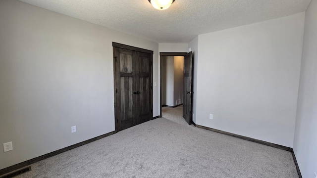 9972 14th Cir NE, Saint Michael, MN 55376 - unfurnished bedroom featuring carpet and a textured ceiling