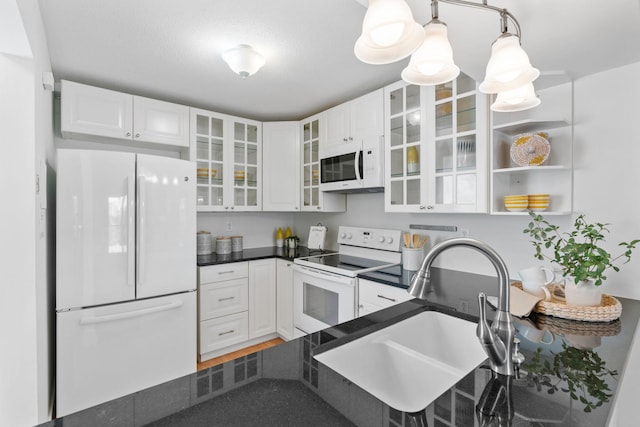 8013 Xerxes Ave S Unit B205, Bloomington, MN 55431 - kitchen with white appliances, dark countertops, white cabinets, glass insert cabinets, and open shelves