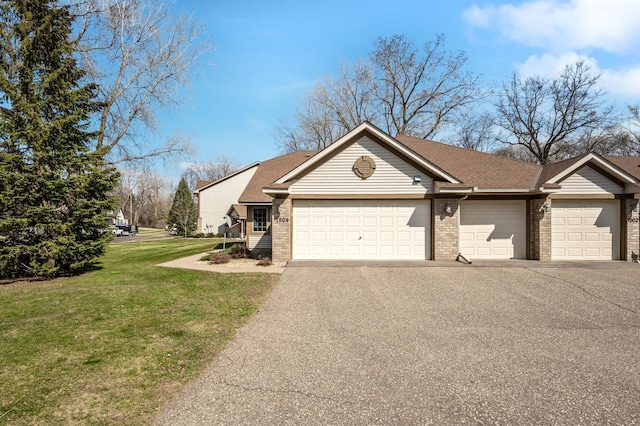 1904 Beebe Rd, Maplewood, MN 55109 - view of front of property with asphalt driveway, a front lawn, a garage, brick siding, and a shingled roof