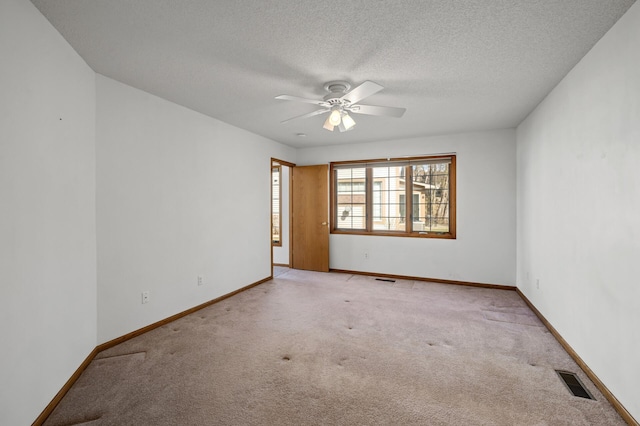 1904 Beebe Rd, Maplewood, MN 55109 - carpeted empty room featuring a ceiling fan, baseboards, and a textured ceiling