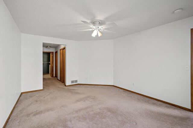 1904 Beebe Rd, Maplewood, MN 55109 - spare room featuring carpet, ceiling fan, baseboards, a smoke detector, and a textured ceiling
