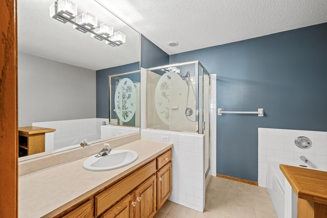 1904 Beebe Rd, Maplewood, MN 55109 - full bath with a textured ceiling, a stall shower, tile patterned flooring, and a garden tub