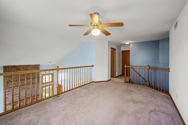 1904 Beebe Rd, Maplewood, MN 55109 - spare room with a ceiling fan, carpet, baseboards, and vaulted ceiling
