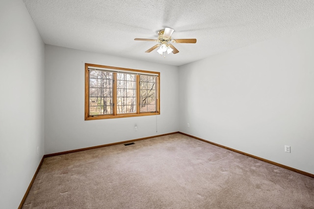 1904 Beebe Rd, Maplewood, MN 55109 - empty room featuring a ceiling fan, carpet floors, a textured ceiling, and baseboards