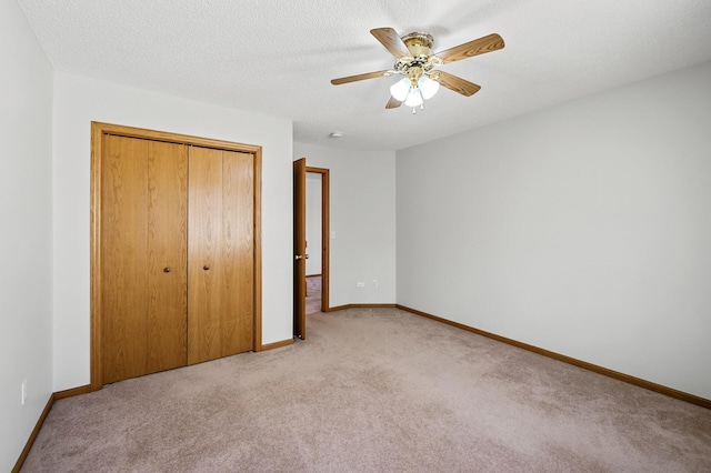 1904 Beebe Rd, Maplewood, MN 55109 - unfurnished bedroom with a closet, light carpet, baseboards, and a ceiling fan