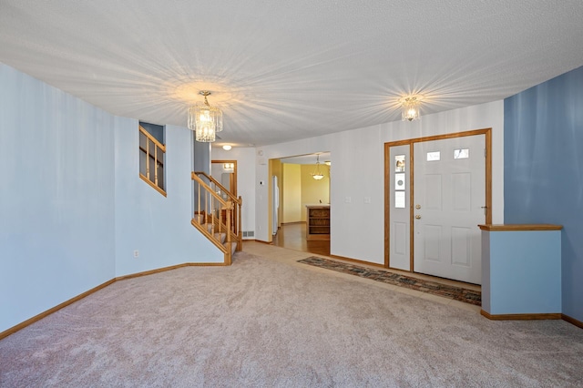 1904 Beebe Rd, Maplewood, MN 55109 - carpeted foyer with stairway, a chandelier, and baseboards