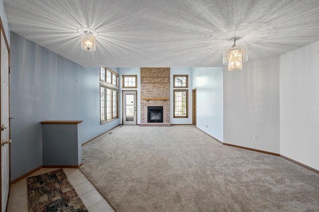 1904 Beebe Rd, Maplewood, MN 55109 - unfurnished living room featuring a chandelier, carpet flooring, a brick fireplace, baseboards, and a textured ceiling