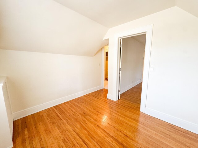 531 Summit Ave, Fergus Falls, MN 56537 - additional living space with vaulted ceiling, light wood-type flooring, and baseboards