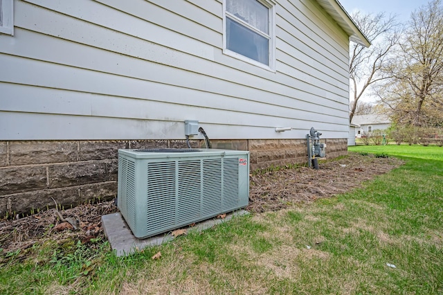 exterior details featuring central air condition unit and gas meter