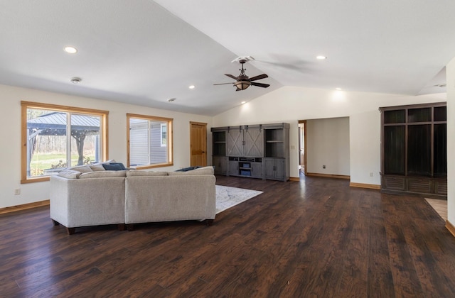 living area with vaulted ceiling, a ceiling fan, dark wood finished floors, baseboards, and recessed lighting